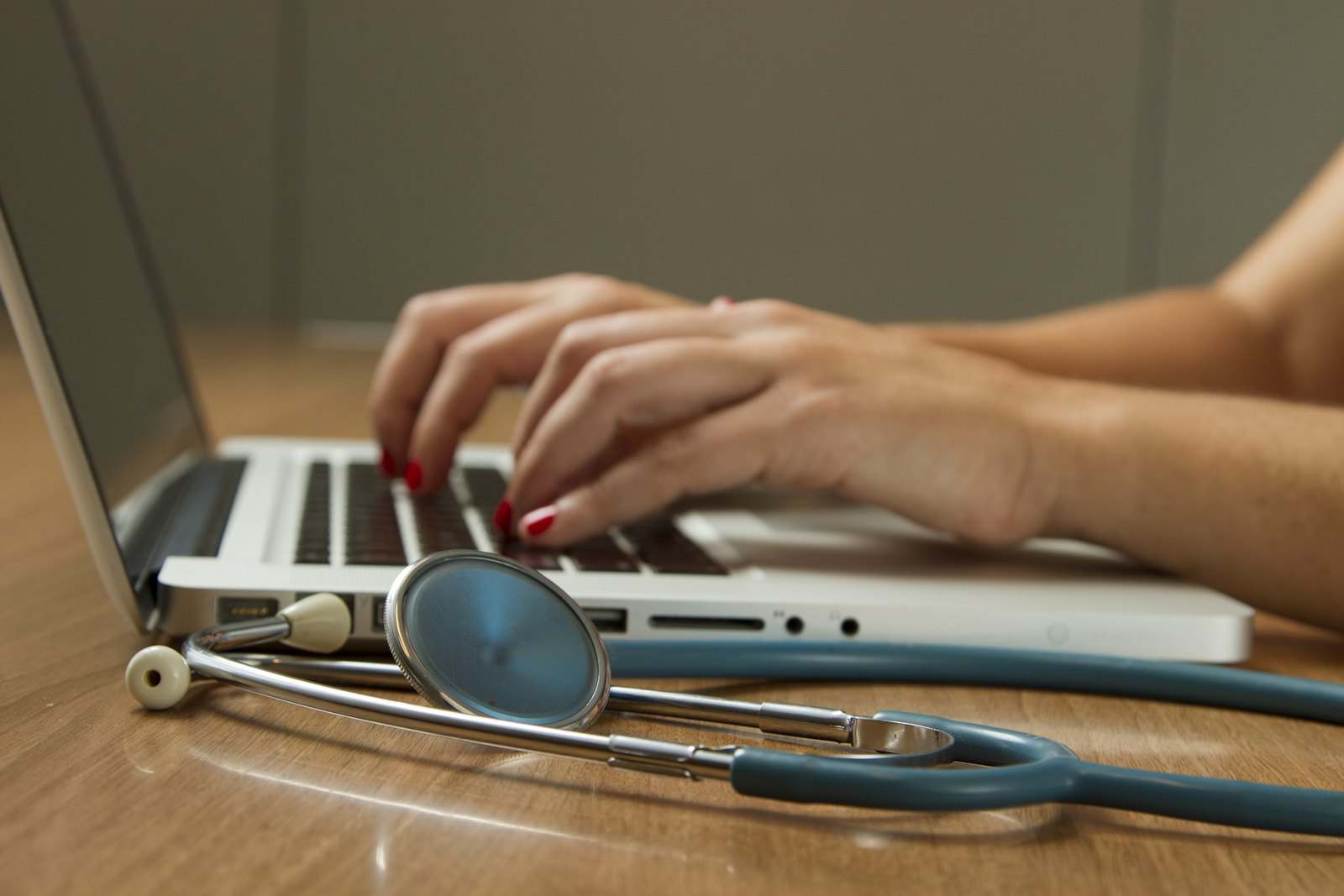 A person working at a laptop in a quiet office.